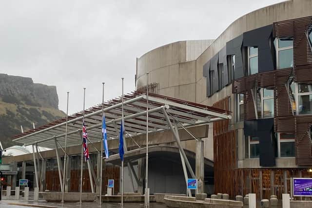 Flags outside the Scottish Parliament in Edinburgh have been flown at half mast to pay tribute to Captain Sir Tom Moore (Photo: Lisa Ferguson).