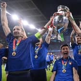 Italy's Giorgio Chiellini and Leonardo Bonucci celebrate with the trophy after winning the UEFA Euro 2020 Final at Wembley Stadium.