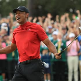 Tiger Woods celebrates on the 18th green after landing a fifth Masters win at Augusta National in 2019. Picture: Andrew Redington/Getty Images.