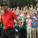 Tiger Woods celebrates on the 18th green after landing a fifth Masters win at Augusta National in 2019. Picture: Andrew Redington/Getty Images.