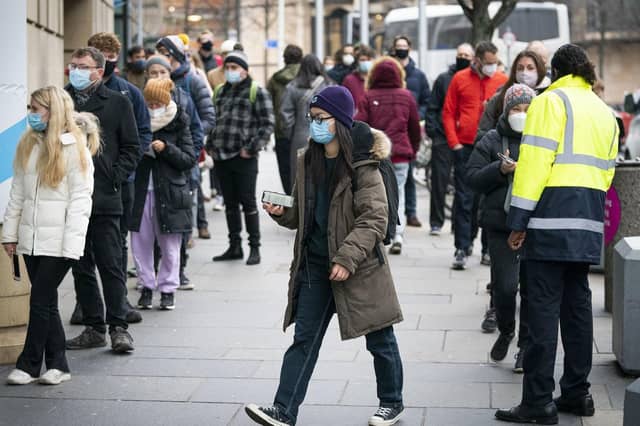 People queue outside the Edinburgh International Conference Centre (EICC) for the NHS Scotland vaccination centre Picture: Jane Barlow/PA Wire.