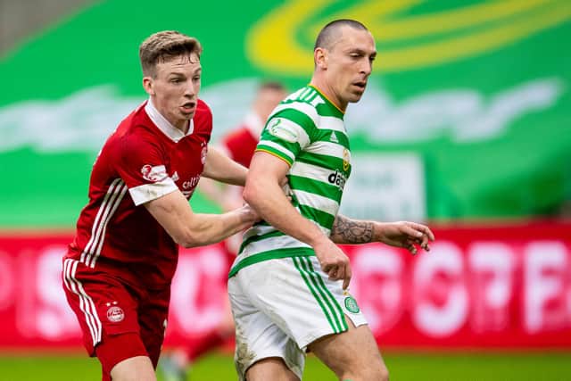Scott Brown in Celtic colours tussling with Aberdeen’s Lewis Ferguson. The pair will be on the same side next season...with all the strangeness that entails. (Photo by Ross MacDonald / SNS Group)