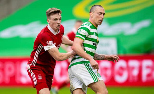 Scott Brown in Celtic colours tussling with  Aberdeen’s Lewis Ferguson. The pair will be on the same side next season...with all the strangeness that entails. (Photo by Ross MacDonald / SNS Group)