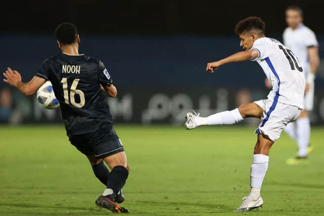 Ghayedi (R) attempts a shot with his right-foot, though predominantly plays on the left or through the middle.  (Photo by AFP via Getty Images)