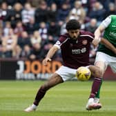 Ellis Simms and Paul Hanlon in action during a cinch Premiership match between Hearts and Hibs at Tynecastle.