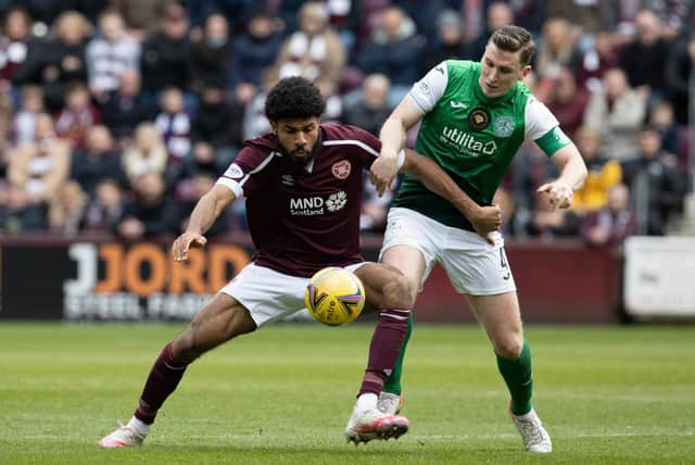 Ellis Simms and Paul Hanlon in action during a cinch Premiership match between Hearts and Hibs at Tynecastle.