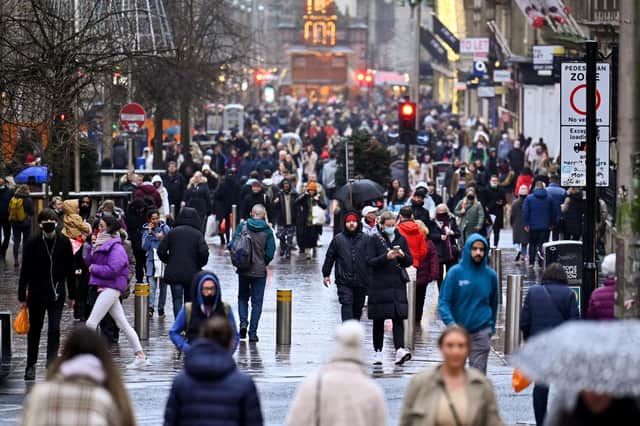 Members of the public continue with their Christmas Shopping in the city centre on December 15