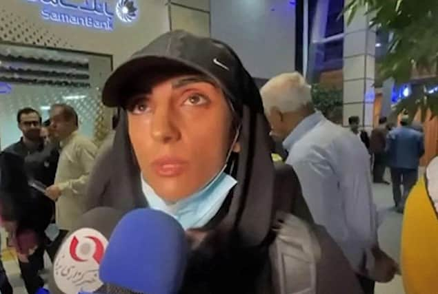 This image grab from footage obtained from Iranian State TV IRIB on October 19, 2022 shows Elnaz Rekabi, an Iranian climber who caused a sensation by competing at an event abroad without a hijab, giving an interview upon her arrival at Imam Khomeini International Airport in Tehran.(Photo by -/AFP via Getty Images)