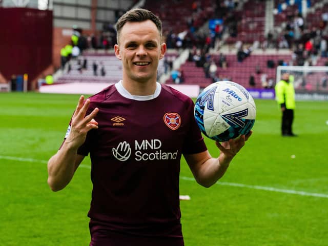 Hearts' Lawrence Shankland with the match ball after scoring a hat-trick against Ross County.