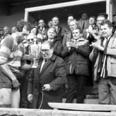 Gary Callander is presented with the McEwan's Division One trophy after Kelso clinched the Scottish championship in March 1988.