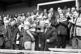 Gary Callander is presented with the McEwan's Division One trophy after Kelso clinched the Scottish championship in March 1988.