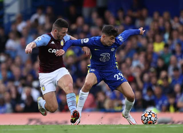 Kai Havertz of Chelsea is challenged by John McGinn of Aston Villa. (Photo by Eddie Keogh/Getty Images)