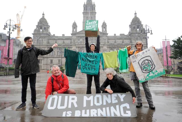 Climate campaigners from Strathclyde Divest and other groups protest outside the headquarters of Glasgow City Council, condemning the authority's pension fund investment in fossil fuel polluters. Picture: Colin Hattersley