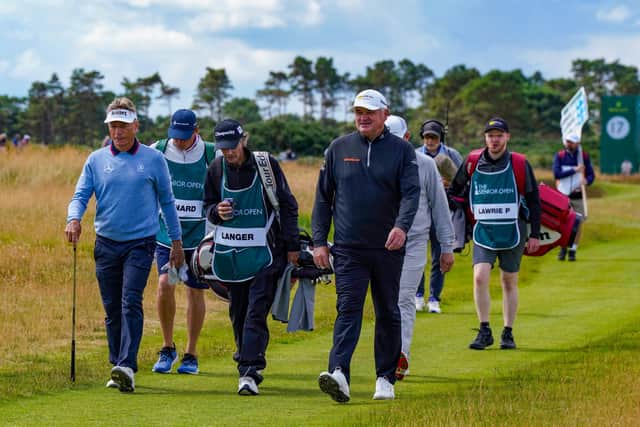 2010 Carnoustie winner Bernhard Langer and Paul Lawrie, who won The Open at the Angus venue in 1999, walk up the 18th fairway  during day two of the Senior Open Championship presented by Rolex at Carnoustie Golf Links. Picture: Phil Inglis/Getty Images.