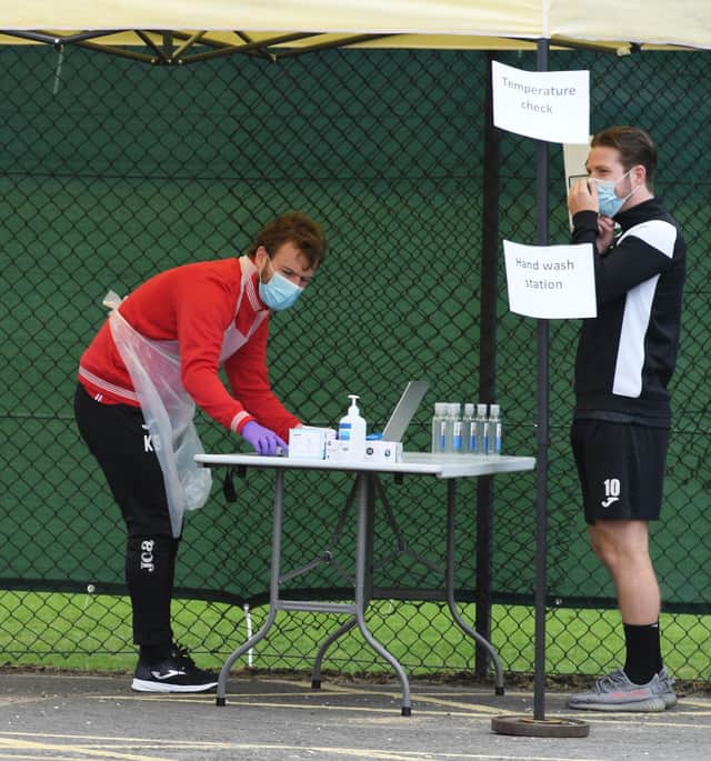 St Mirren's Kyle McAllister has his temperature taken.