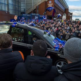 Fans gathered as the funeral car passed by Ibrox.