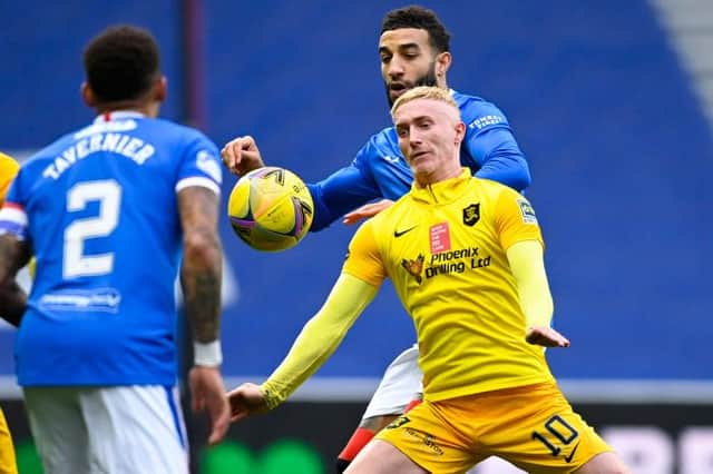 Livingston's Craig Sibbald (centre) holds off Rangers' Connor Goldson during a Scottish Premiership match between Rangers and Livingston at Ibrox Stadium, on October 25, 2020, in Glasgow, Scotland. (Photo by Rob Casey / SNS Group)