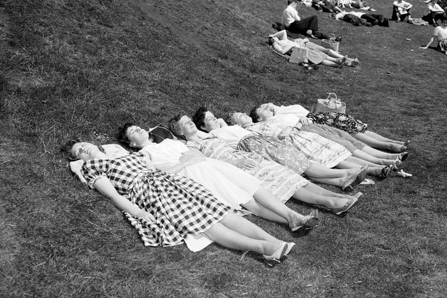Girls sunbathing in Princes Street Gardens during a heatwave in Edinburgh in June 1960.