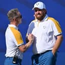 European captain Luke Donald greets Shane Lowry on the first tee on the first official practice day for the 44th Ryder Cup at Marco Simone Golf and Country Club in Rome. Picture: Alberto Pizzoli/AFP via Getty Images.