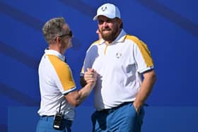 European captain Luke Donald greets Shane Lowry on the first tee on the first official practice day for the 44th Ryder Cup at Marco Simone Golf and Country Club in Rome. Picture: Alberto Pizzoli/AFP via Getty Images.