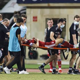 Andy Considine is stretchered off the pitch in Baku after picking up a serious injury against Qarabag.