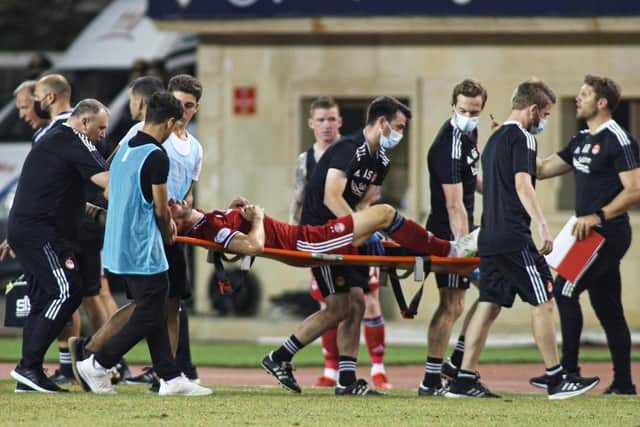 Andy Considine is stretchered off the pitch in Baku after picking up a serious injury against Qarabag.