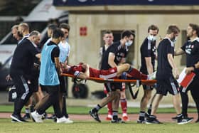 Andy Considine is stretchered off the pitch in Baku after picking up a serious injury against Qarabag.