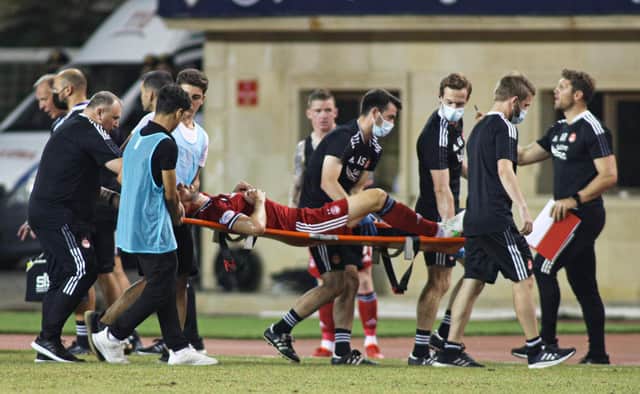 Andy Considine is stretchered off the pitch in Baku after picking up a serious injury against Qarabag.