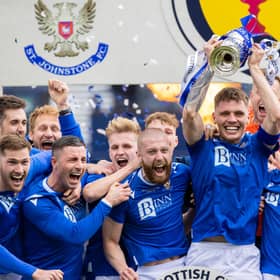 St Johnstone captain Jason Kerr lifts the Scottish Cup.