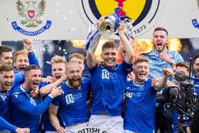 St Johnstone captain Jason Kerr lifts the Scottish Cup.