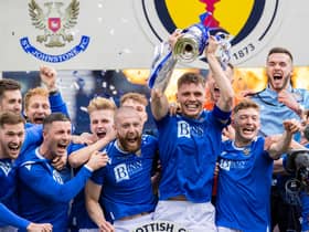 St Johnstone captain Jason Kerr lifts the Scottish Cup.