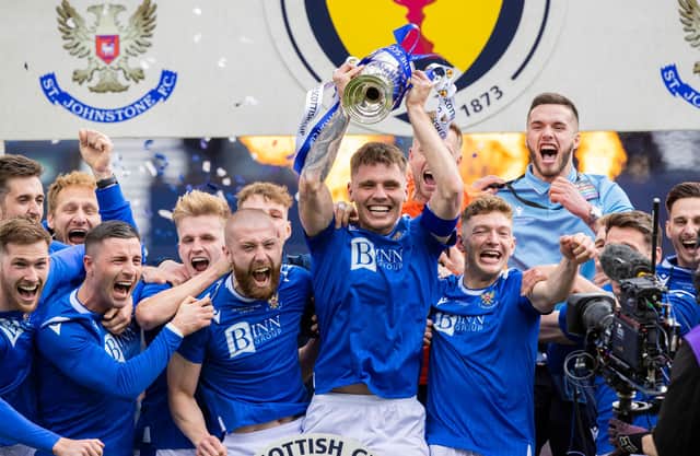 St Johnstone captain Jason Kerr lifts the Scottish Cup.