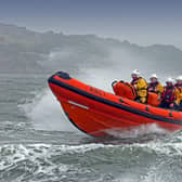 Two people have been rescued after they had to abandon their sinking fishing boat and take to a life raft.