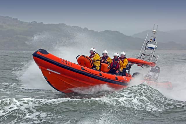 Two people have been rescued after they had to abandon their sinking fishing boat and take to a life raft.