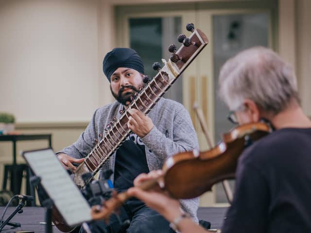 Jasdeep Singh Degun working on his new composition with the Scottish Ensemble PIC: Foxbrush