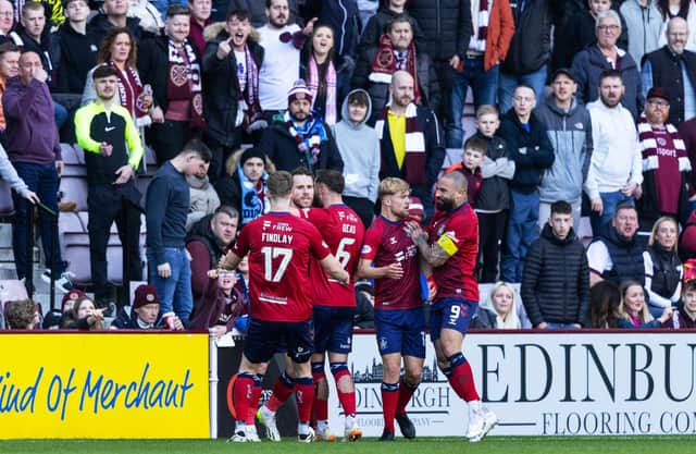 Marley Watkins is mobbed by his Kilmarnock team-mates after levelling at Tynecastle.