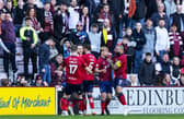 Marley Watkins is mobbed by his Kilmarnock team-mates after levelling at Tynecastle.
