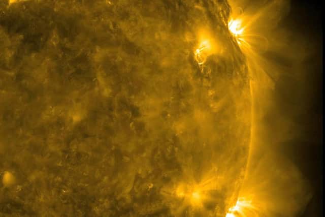 Image: NASA handout photo taken from its Solar Dynamics Observatory (SDO) of two solar flares seen in extreme ultraviolet light over a three day period (2011).