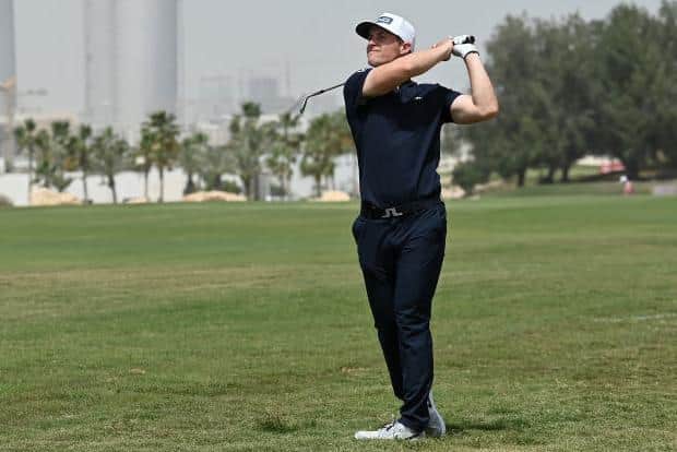 Calum Hill hits his approach shot on the ninth hole in the second round of the Commercial Bank Qatar Masters at Doha Golf Club. Picture: Stuart Franklin/Getty Images.