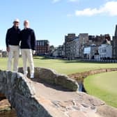 Billy Horschel and his father, Billy Horschel snr, pose for a photograph on the 18th hole during a practice round ahead of the Alfred Dunhill Links Championship. Picture: Matthew Lewis/Getty Images.