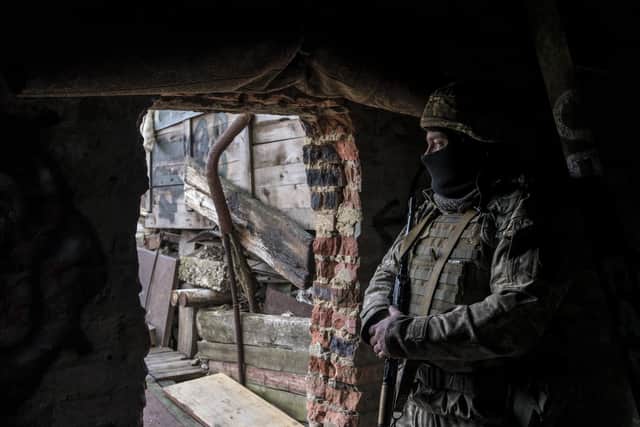 A Ukrainian soldier in a front-line position on December 8, 2021 in Marinka, Ukraine. (Image credit: Brendan Hoffman/Getty Images)
