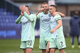 Hibs' Ryan Porteous and Kyle Magennis at full time during a cinch Premiership match between Ross County and Hibernian at the Global Energy Stadium, on October 01, 2022, in Dingwall, Scotland. (Photo by Rob Casey / SNS Group)