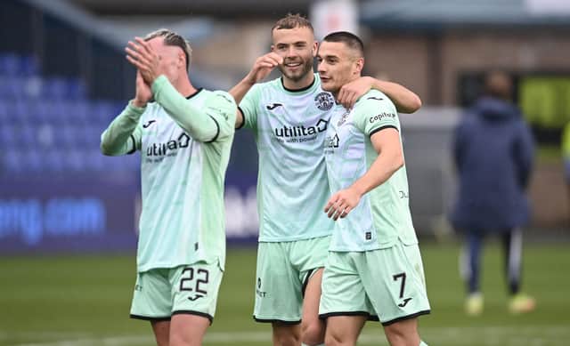 Hibs' Ryan Porteous and Kyle Magennis at full time during a cinch Premiership match between Ross County and Hibernian at the Global Energy Stadium, on October 01, 2022, in Dingwall, Scotland. (Photo by Rob Casey / SNS Group)