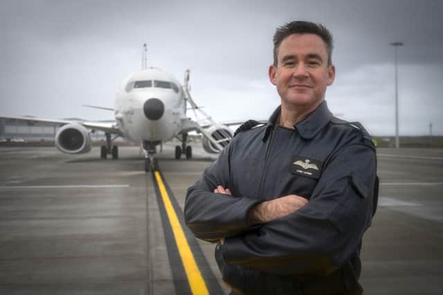 Group Captain Chris Layden, station commander, in front of the first of the Poseidon MRA1 plane at RAF Lossiemouth.