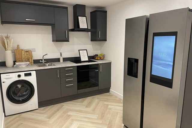 The kitchen in the Net Zero Home has several energy-efficient appliances, including a smart fridge that can show you its contents without opening the door and even suggests meals you could cook up with the ingredients inside
