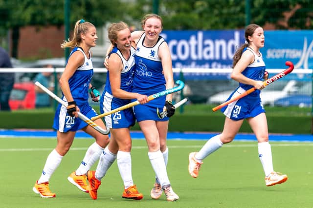 Emily Dark celebrates with team-mate Kate Holmes after scoring for Scotland against Ukraine at the Euros in Glasgow last year. Picture: Mark Pugh