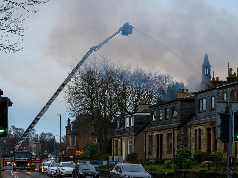 The road remains closed to allow firefighters to tackle the flames.