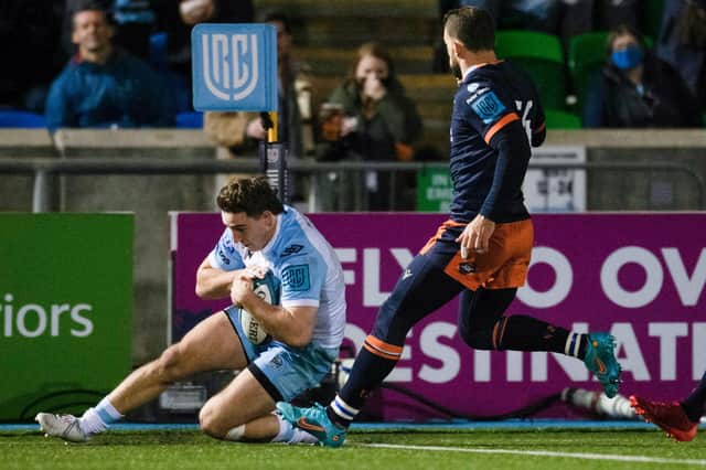 Glasgow's Josh McKay (L) scores a try during a United Rugby Championship match between Glasgow Warriors and Edinburgh Rugby at Scotstoun Stadium, on March 18, 2022, in Glasgow, Scotland.  (Photo by Ross MacDonald / SNS Group)