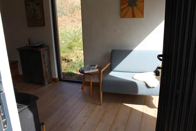 Each tin bothy has a small living area with kitchen, mezzanine sleeping area accessed by a ladder, private deck, open fire pit, and wood fired pizza oven. There’s no running water, so the bathroom facilities are an outdoor shower and a private eco toilet.