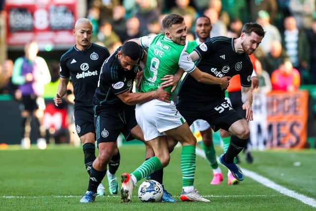 Celtic defender Cameron Carter-Vickers wrestles with Hibs striker Dylan Vente for possession.  (Photo by Alan Harvey / SNS Group)